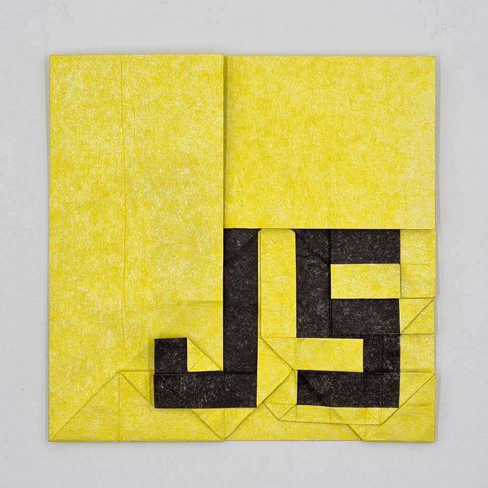 Origami JS logo folded from yellow and black paper. The letter shapes are rectangular instead of smoothly curved.